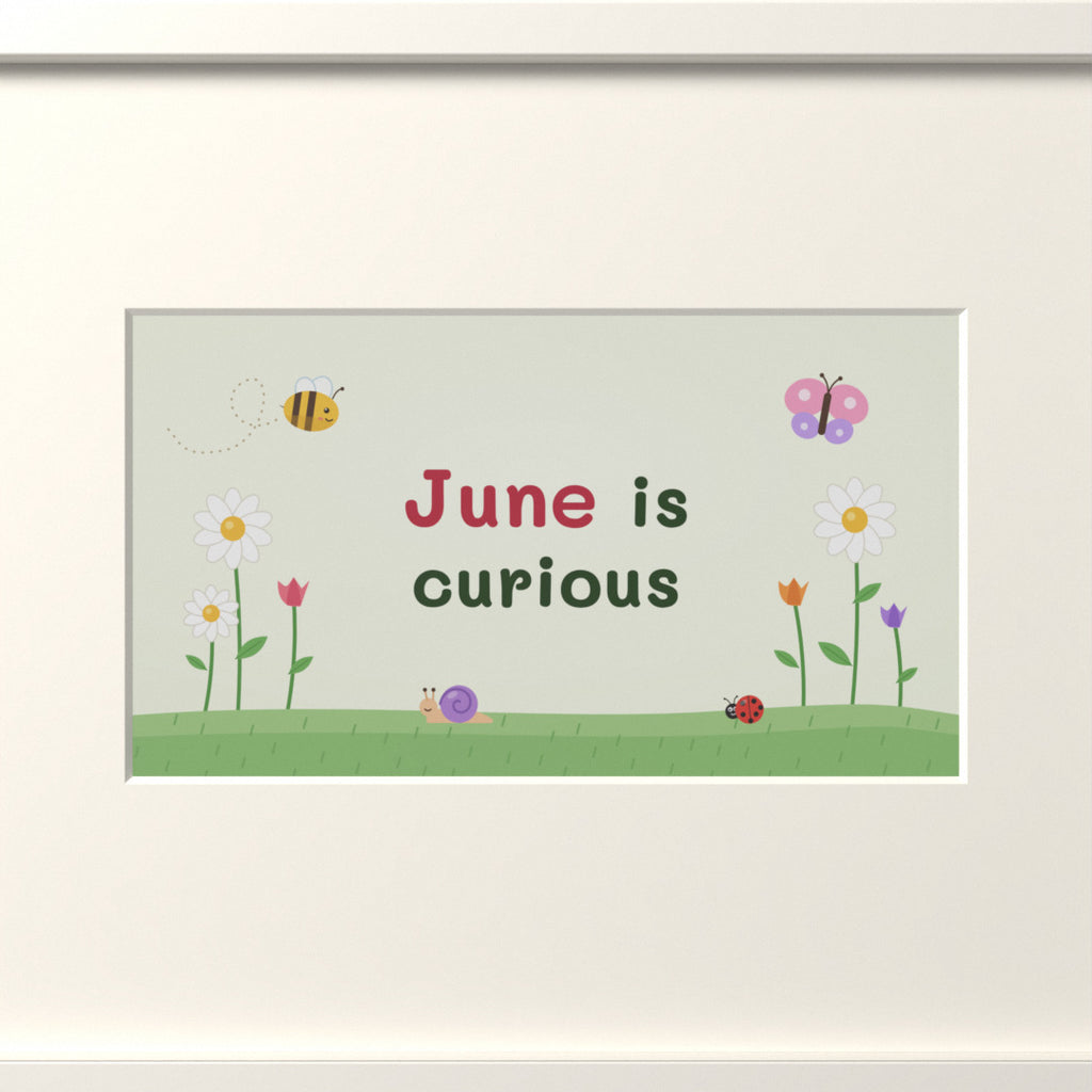 Quoteplume Kids screen in its mat: "June is curious"