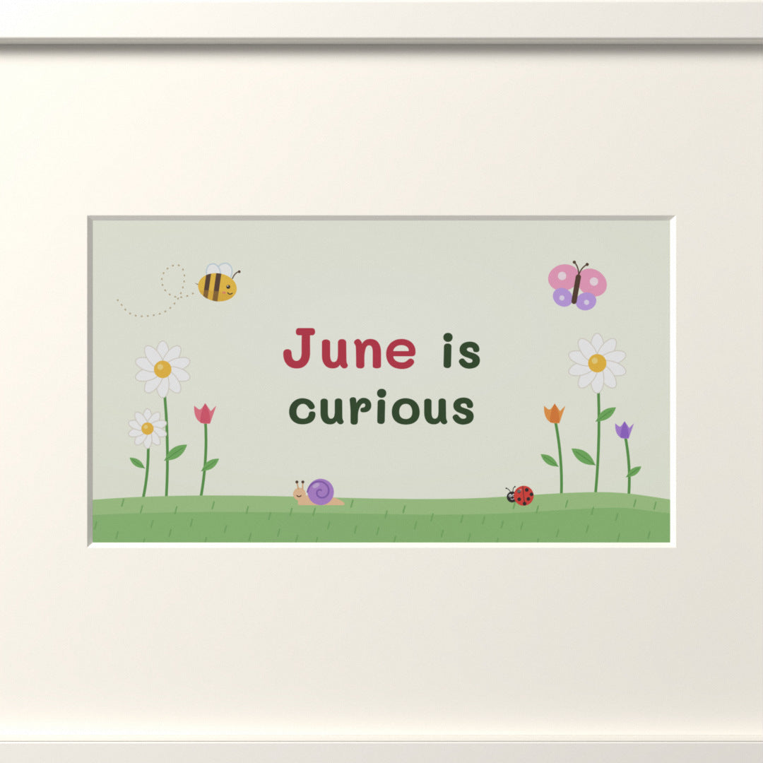 Quoteplume Kids screen in its mat: "June is curious"